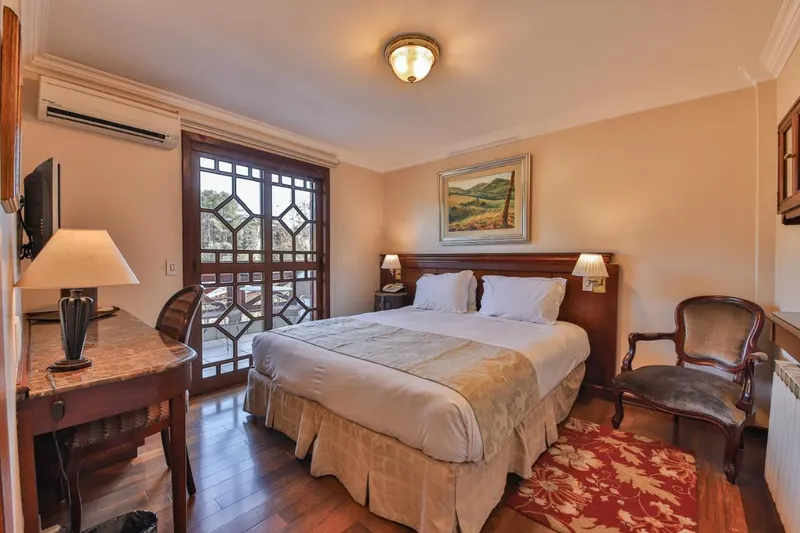 Quarto em Le Suisse Elegance Hotel