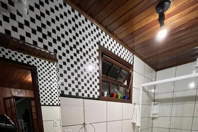 Banheiro em Pousada Araucaria Suites