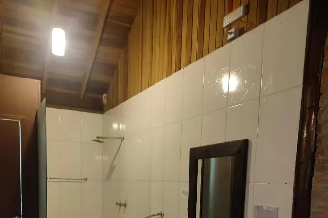 Banheiro em Pousada Pássaro de Fogo
