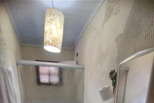 Banheiro em Pousada Serrano
