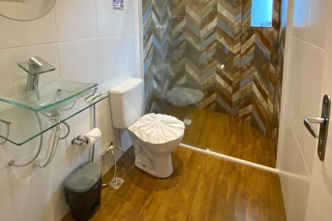 Banheiro em Pousada Vila Tio Lé